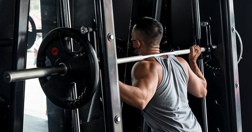 a man is doing a smith machine squat